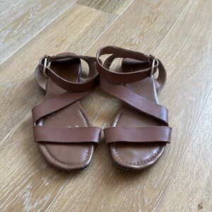 Flat sandals.